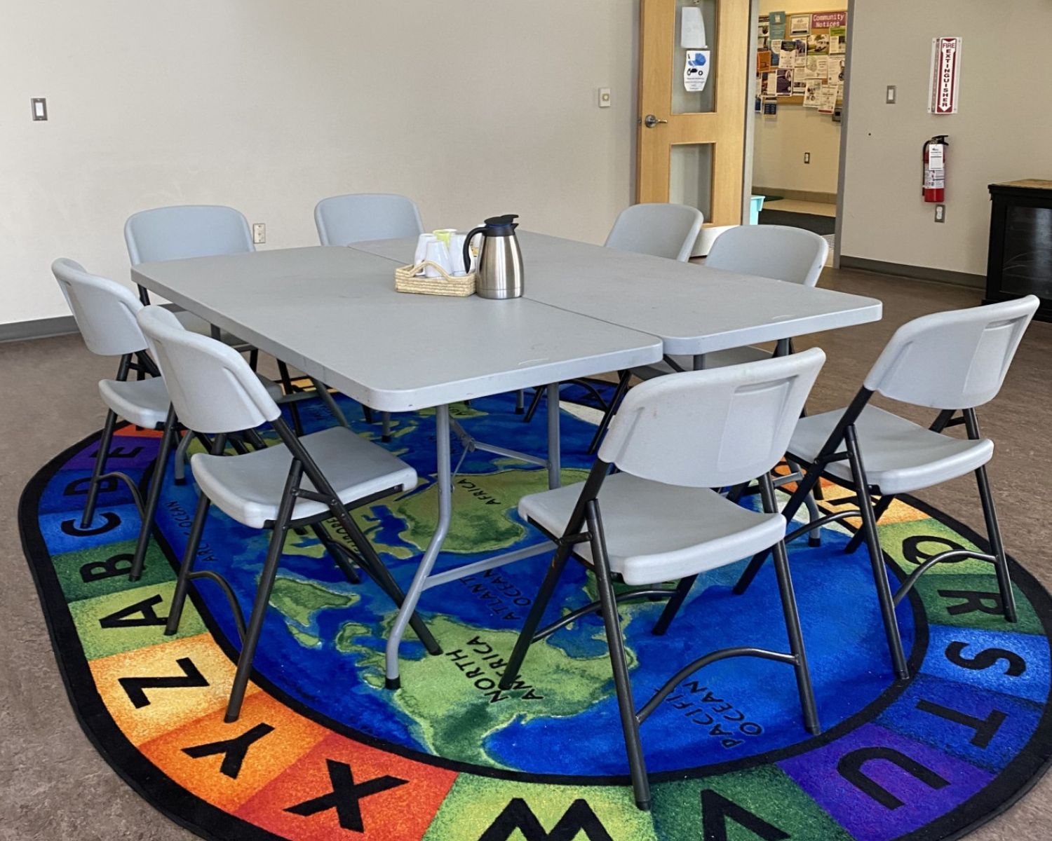 A picture of the Perth East Public Library program room with table and chairs set up