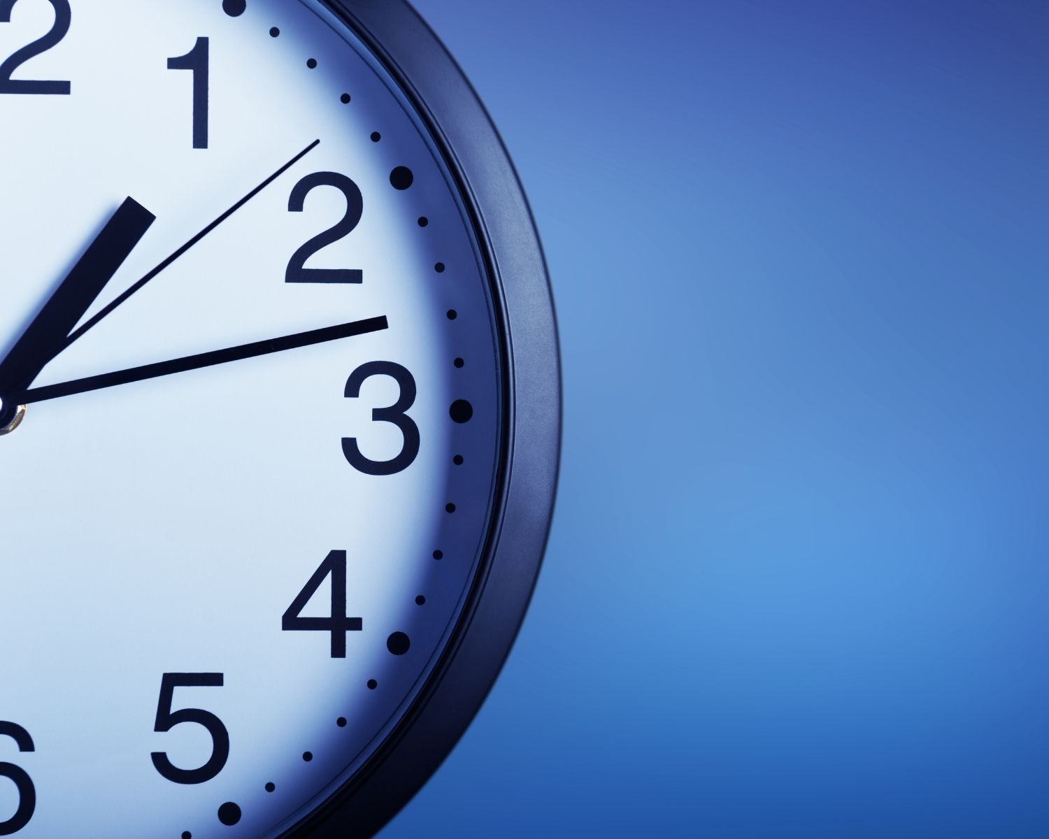 An image of a clock with a blue background